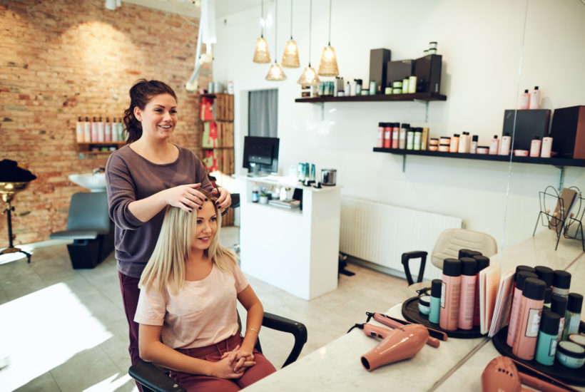 Young Woman Talking with Her Hairstylist During a Salon Appointment Beauty Army everything you need to know about opening a salon